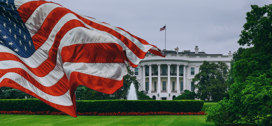 American flag flies in front of the White House